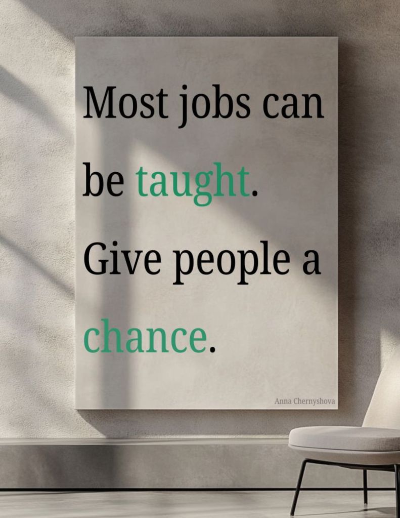 Poster on a wall with the quote “Most jobs can be taught. Give people a chance.” – Anna Chernyshova, with the words "taught" and "chance" highlighted in green.